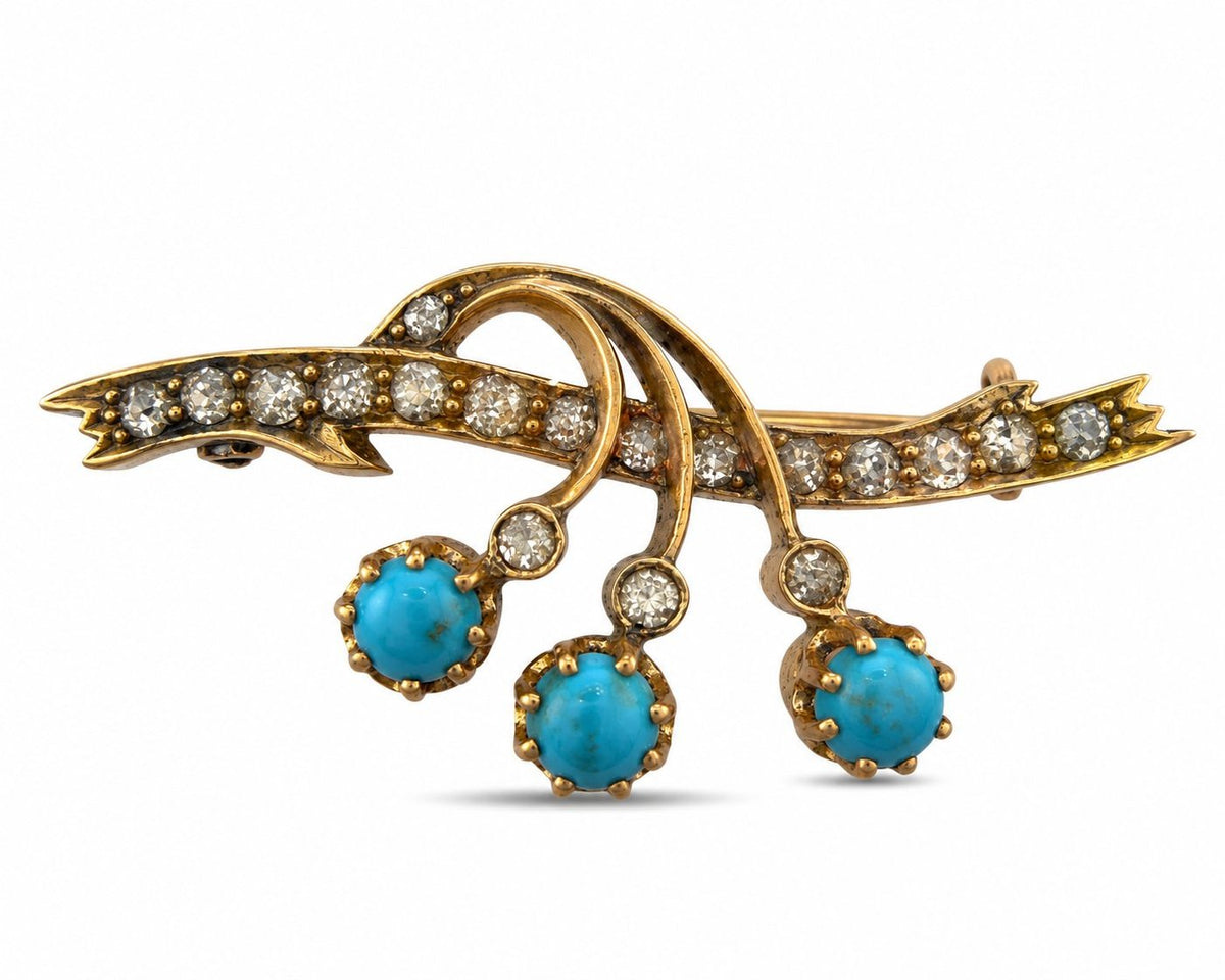 Rose gold brooch with diamond-set swirls and three turquoise drops