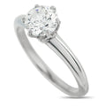 Platinum diamond solitaire ring with round center stone and four-prong setting