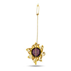 Gold sunburst brooch with round dark amethyst center on a slender chain