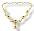 18k gold necklace with ruby and diamond pavé links and a dangling drop pendant