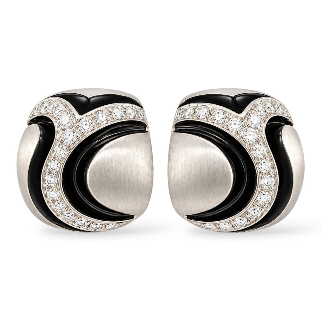 18K white gold diamond earrings with sculpted black enamel accents, shown as a pair