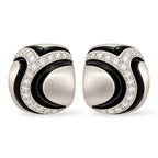 18K white gold diamond earrings with sculpted black enamel accents, shown as a pair