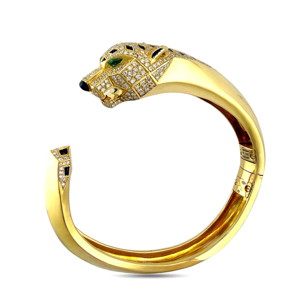 Cartier Panthere de Cartier 18K yellow gold bangle with diamond, emerald and onyx panther head