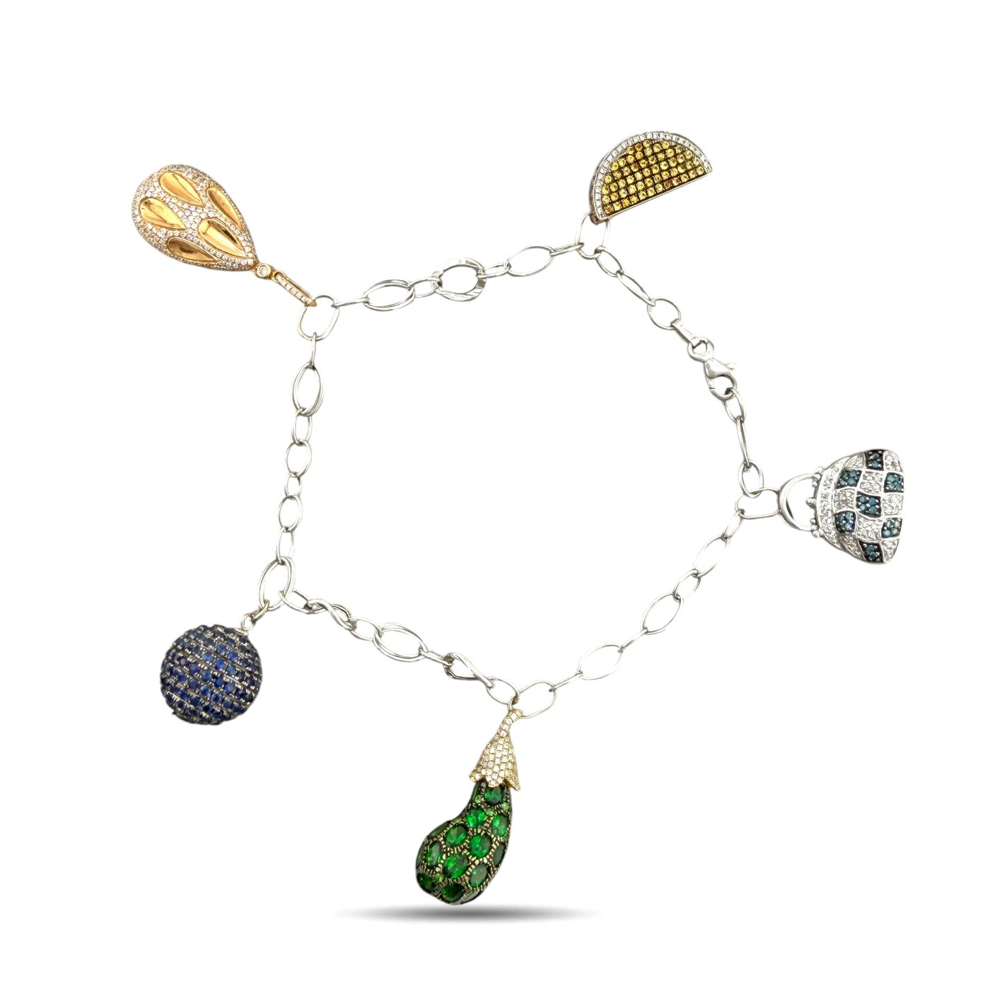 Three-tone gold charm bracelet with yellow, blue, and emerald green teardrop pendants