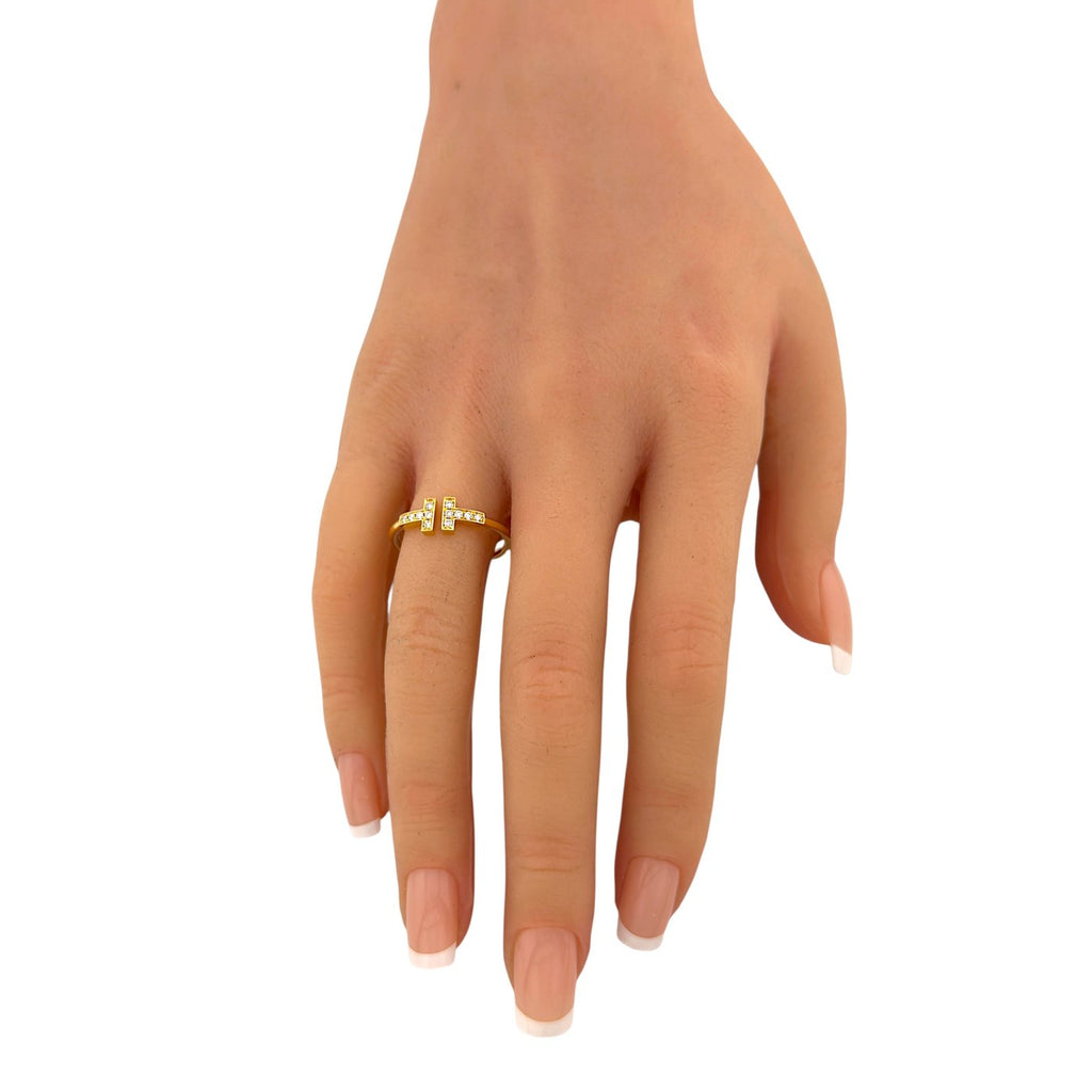 Tiffany & Co. 18k yellow gold diamond cross ring on finger, side angle