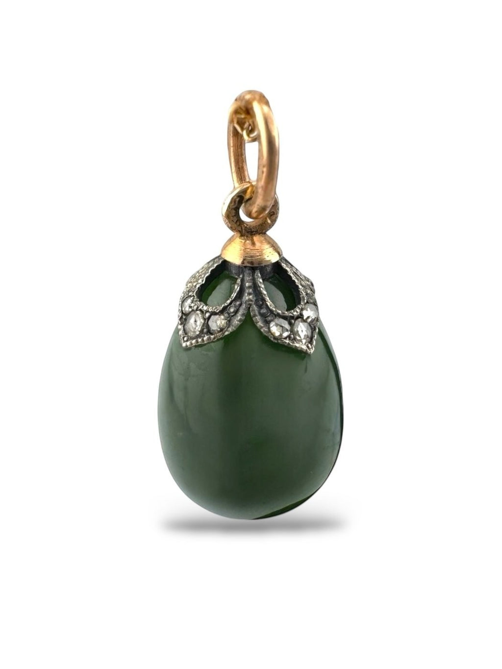 Gold-tone pendant with green enamel teardrop and diamond-like frame at the cap
