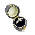 Rose gold marquise diamond ring with three stones in open setting