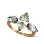 Rose gold marquise diamond ring with large center stone and two marquise side stones