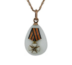 Teardrop egg pendant with enamel and gold military ribbon motif on a chain