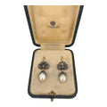 Rose-gold earrings with diamond cluster settings and white teardrop pearls, in box