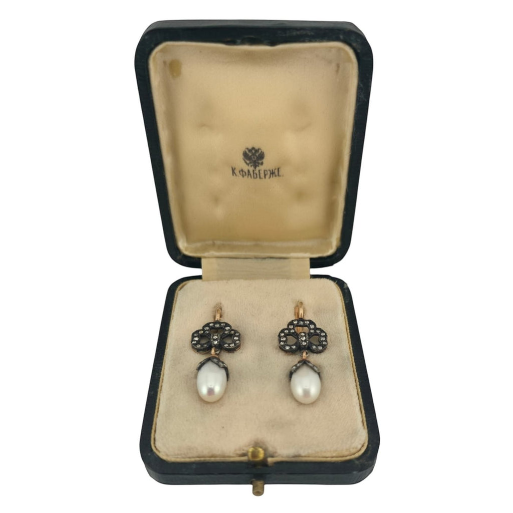 Rose-gold earrings with diamond cluster tops and white teardrop pearls, in open box
