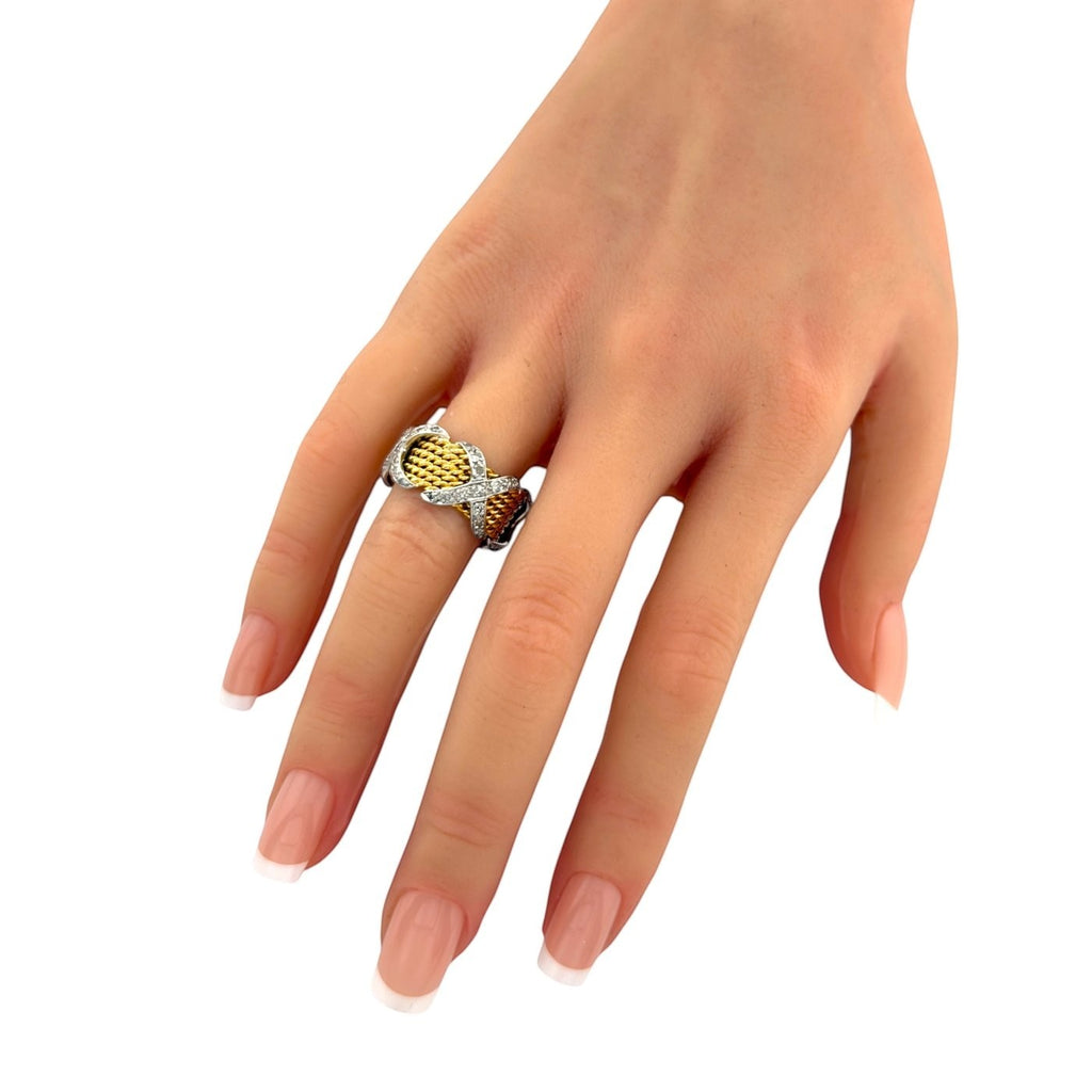 Gold and platinum diamond ring with textured basket band, worn on hand