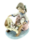 LLADRO porcelain figurine of girl rocking with white kittens on blue base