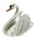 Porcelain swan figurine with wings spread, white with brown beak and eyes