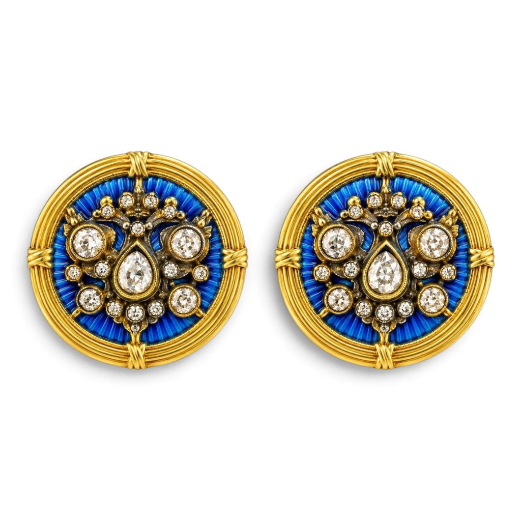 Pair of round gold-tone cufflinks with blue enamel crest and diamond-like accents